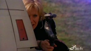 Sam holding a zat gun